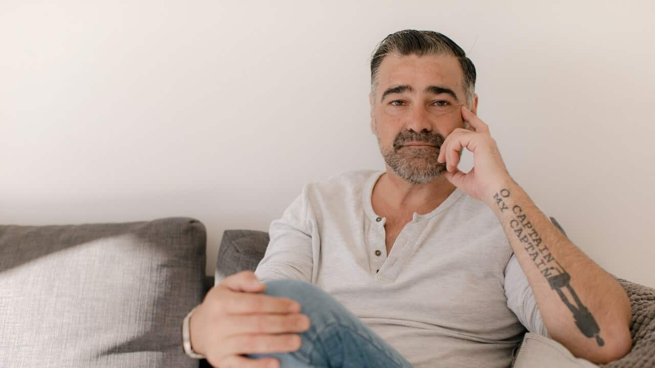 Man sitting on a couch. 