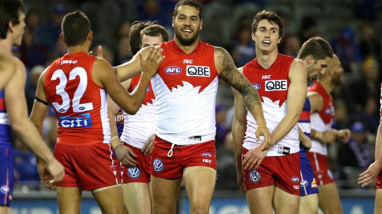 Swans players celebrate another goal from Lance Franklin