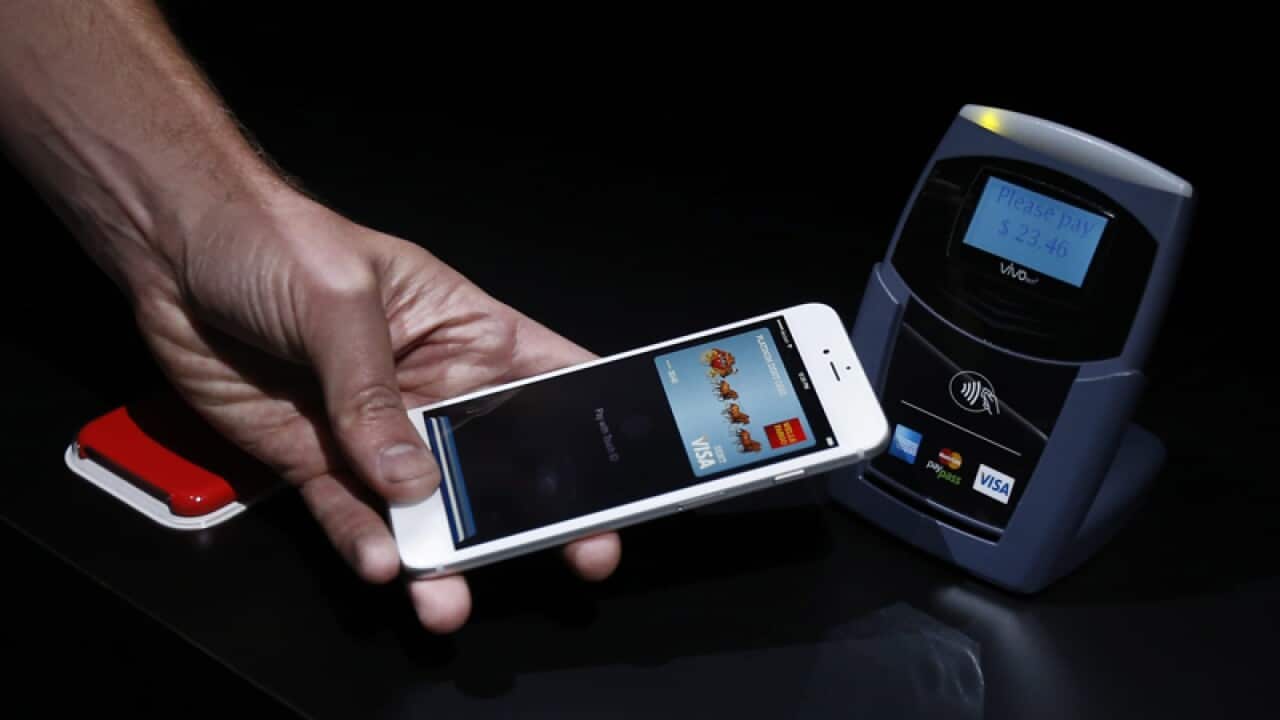 A demonstration of Apple Pay on an iPhone