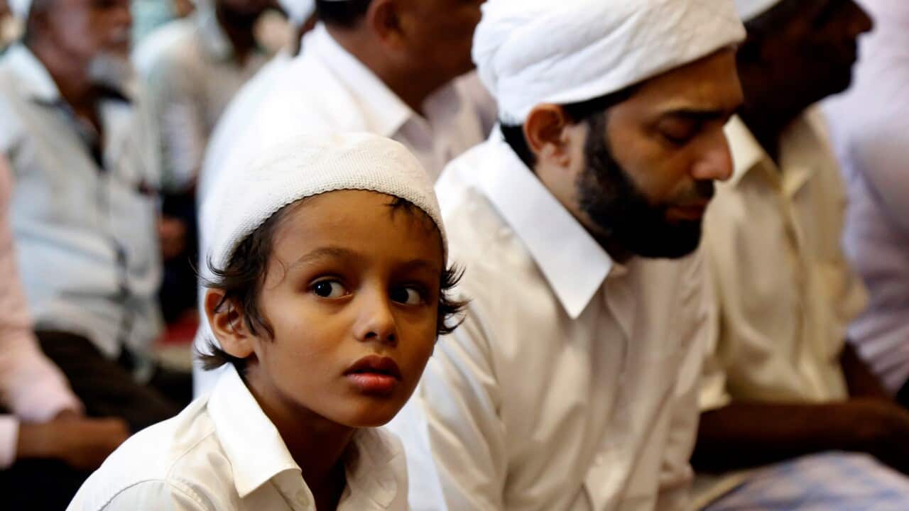 Sri Lankan Muslims offer Friday prayers at Dawatagaha mosque at Town Hall in Colombo.