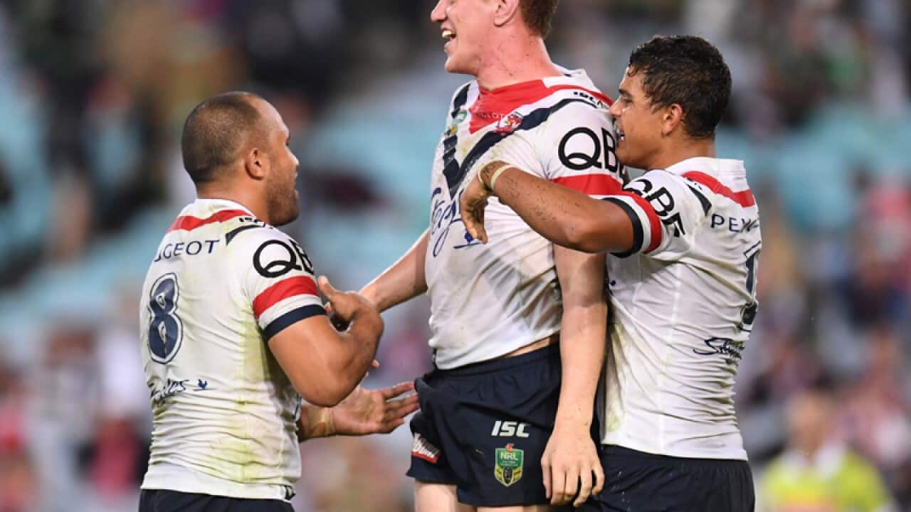 Sydney Roosters front-rower Dylan Napa (C) celebrates