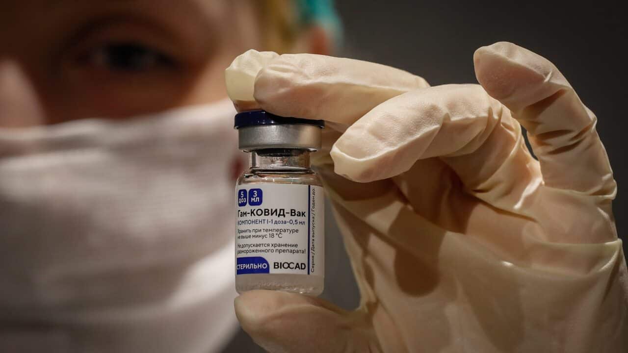 Russian medic holds Russia's Sputnik V Gam-COVID-Vac vaccine at the vaccination point at the State Department Store GUM in Moscow on 19 January 2021.