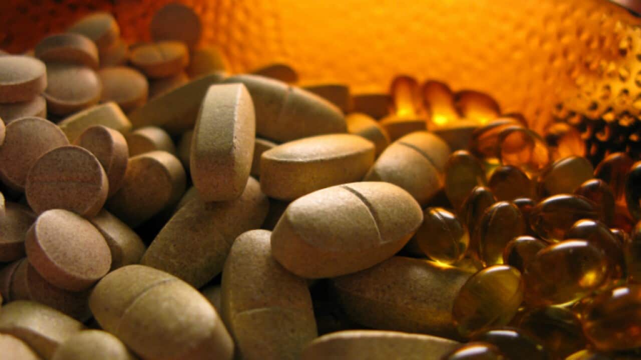 Pills in yellow glass container