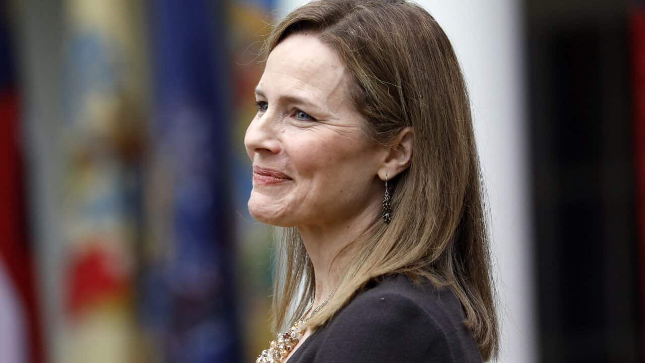 Judge Amy Coney Barrett reacts as President Donald Trump introduces her as his Supreme Court nominee.SS.COM.
