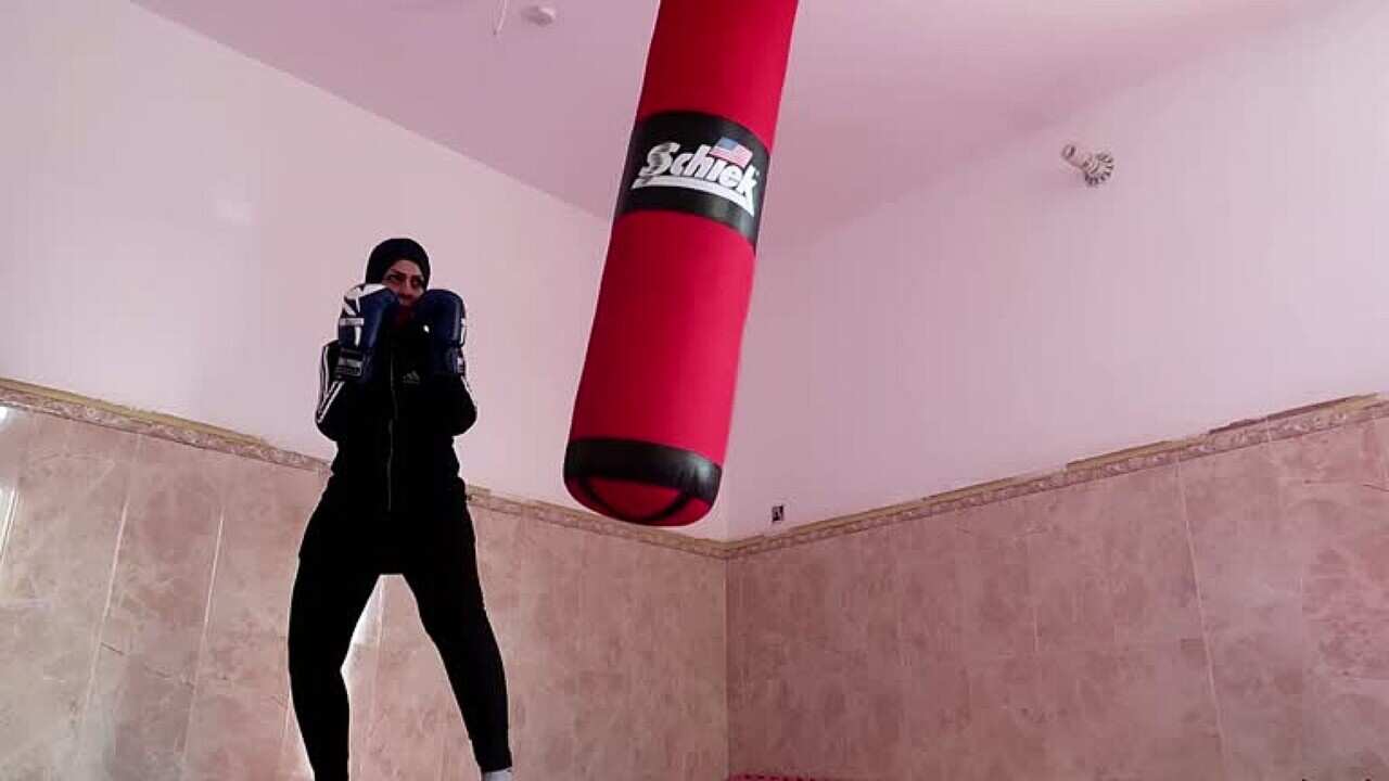 Bushra Abdel-Zahra working out in her home (Reuters).