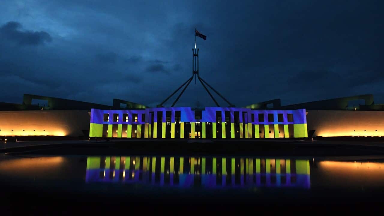 Australia’s Parliament House is illuminated with the colours of Ukraine’s flag in solidarity with the country's people and government (AAP)