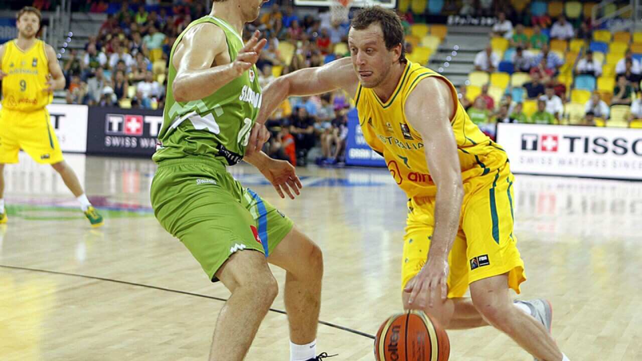 Australian Joe Ingles vies for the ball with Slovenian Domen Lorbek
