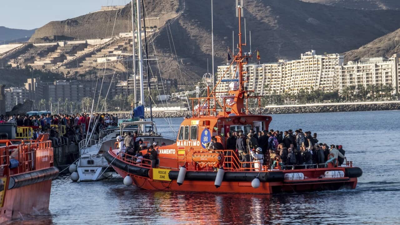 Migrants arrive onboard a maritime rescue ship at the Arguineguin port in Gran Canaria