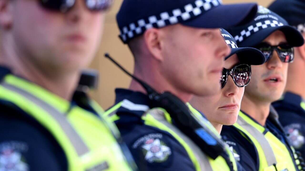 Female police officers with their male collegues