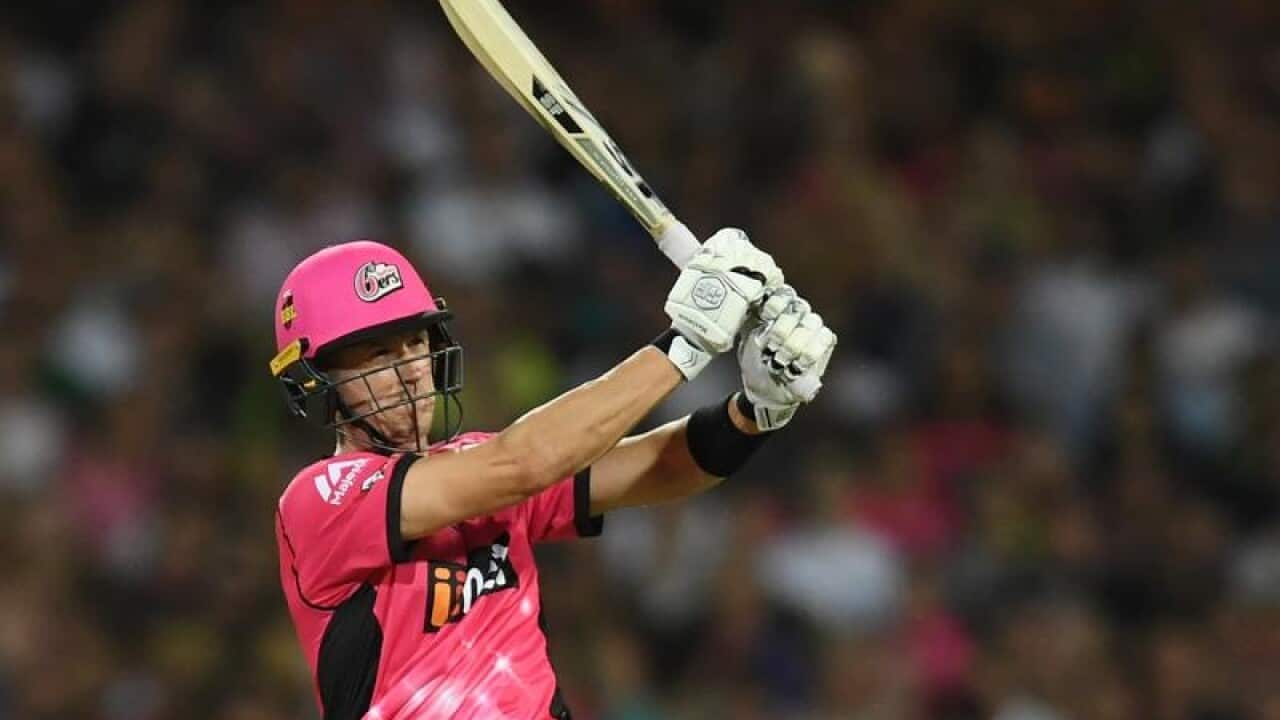 Joe Denly of the Sixers hits a six during the Big Bash League.