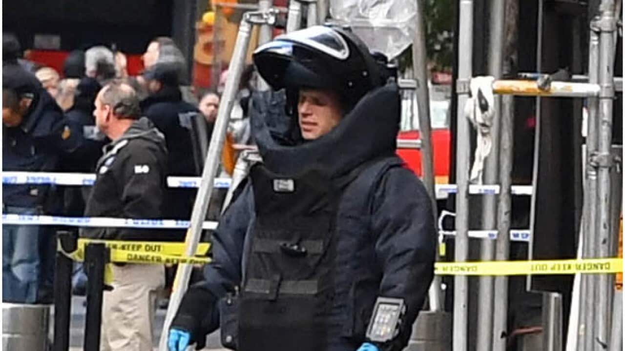 A Bomb Squad technician in a bomb suit outside CNN’s New York office.