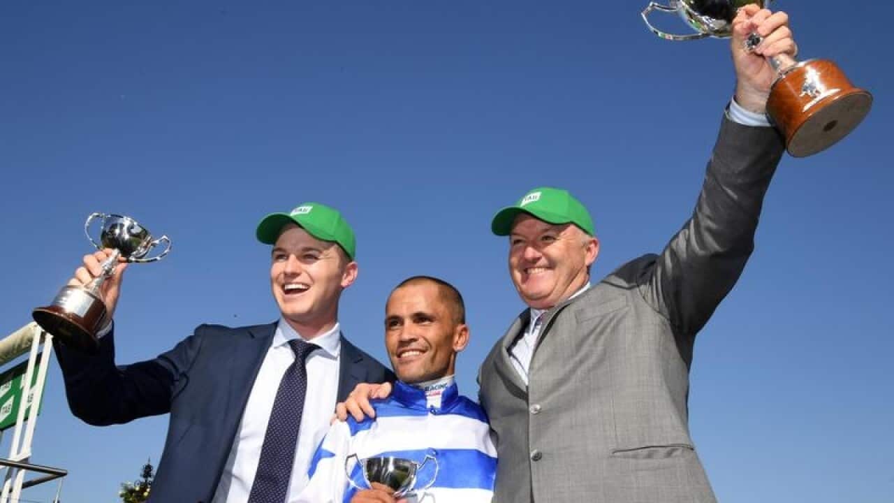 (L-R) Trainer Ben Hayes, jockey Michael Walker and trainer David Hayes