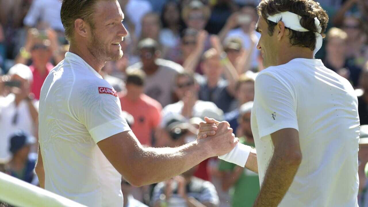 Roger Federer of Switzerland (R)