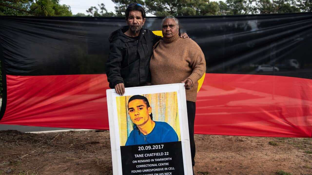 Tane Chatfields parents Colin and Nioka Chatfield pose for a photograph outside the inquest into Tane Chatfields death in custody.