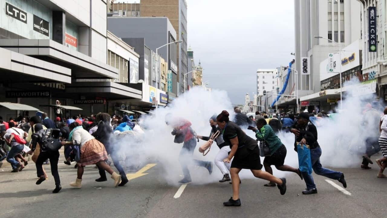 A skirmish as thousands of people rally against xenophobia in Durban