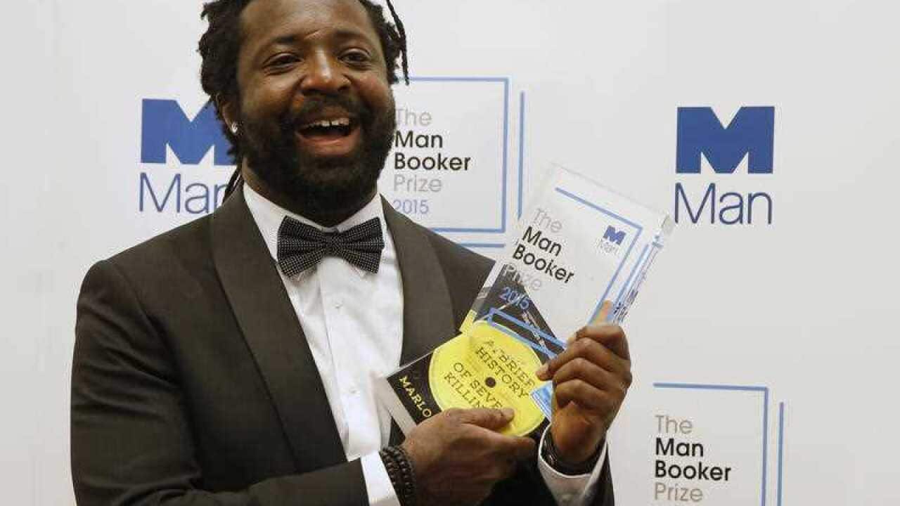 Jamaican author Marlon James holds the award after his book 'A Brief History of Seven Killings' was named as winner of the 2015 Booker Prize 2015 for Fiction (AAP)