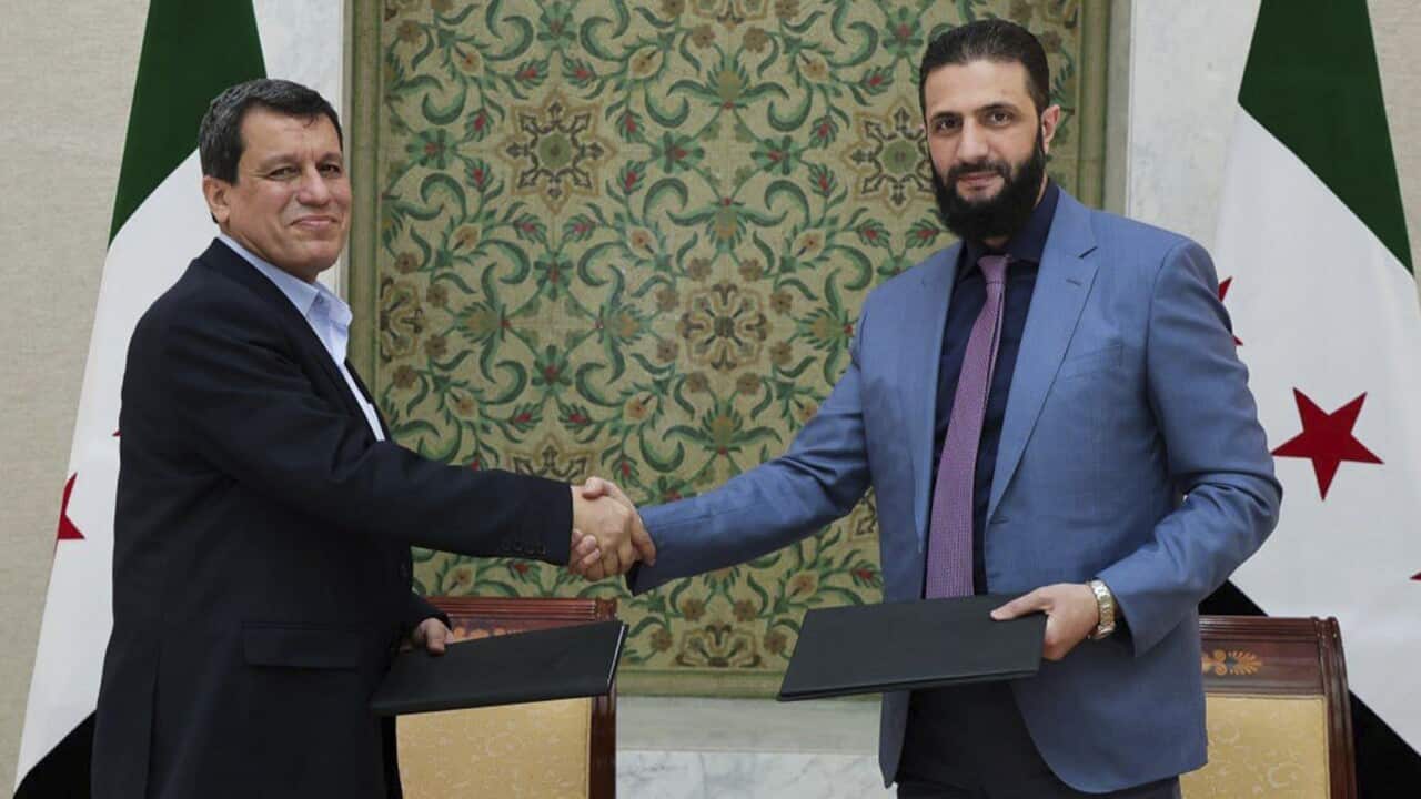 Syria's interim President Ahmad al-Sharaa and SDF commander Mazloum Abdi (AAP)