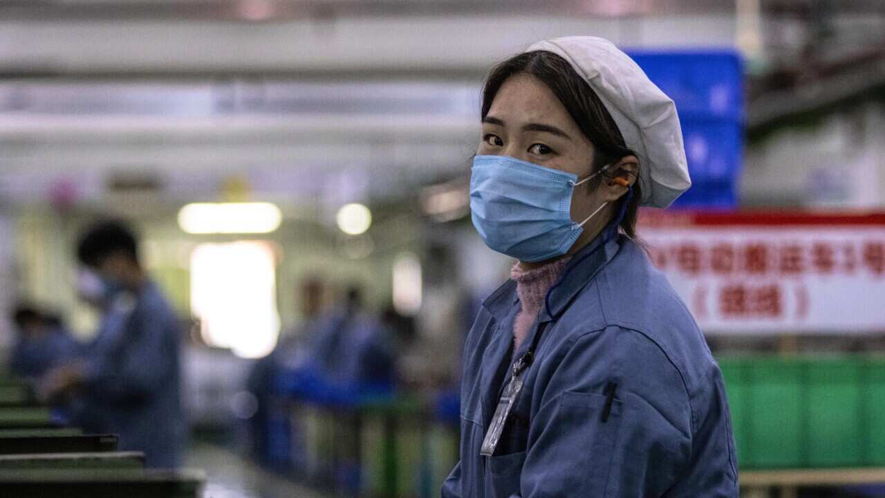 A woman at the Galanz factory in Foshan, China. According to media reports, some factories are resuming operations after shutting down because of the virus.