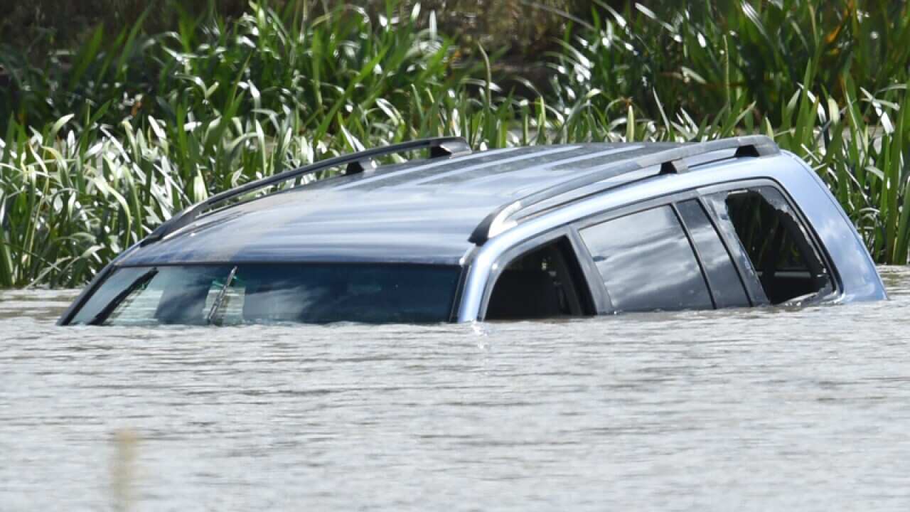 The scene where a 4WD lays submerged in Lake Gladman, Melbourne