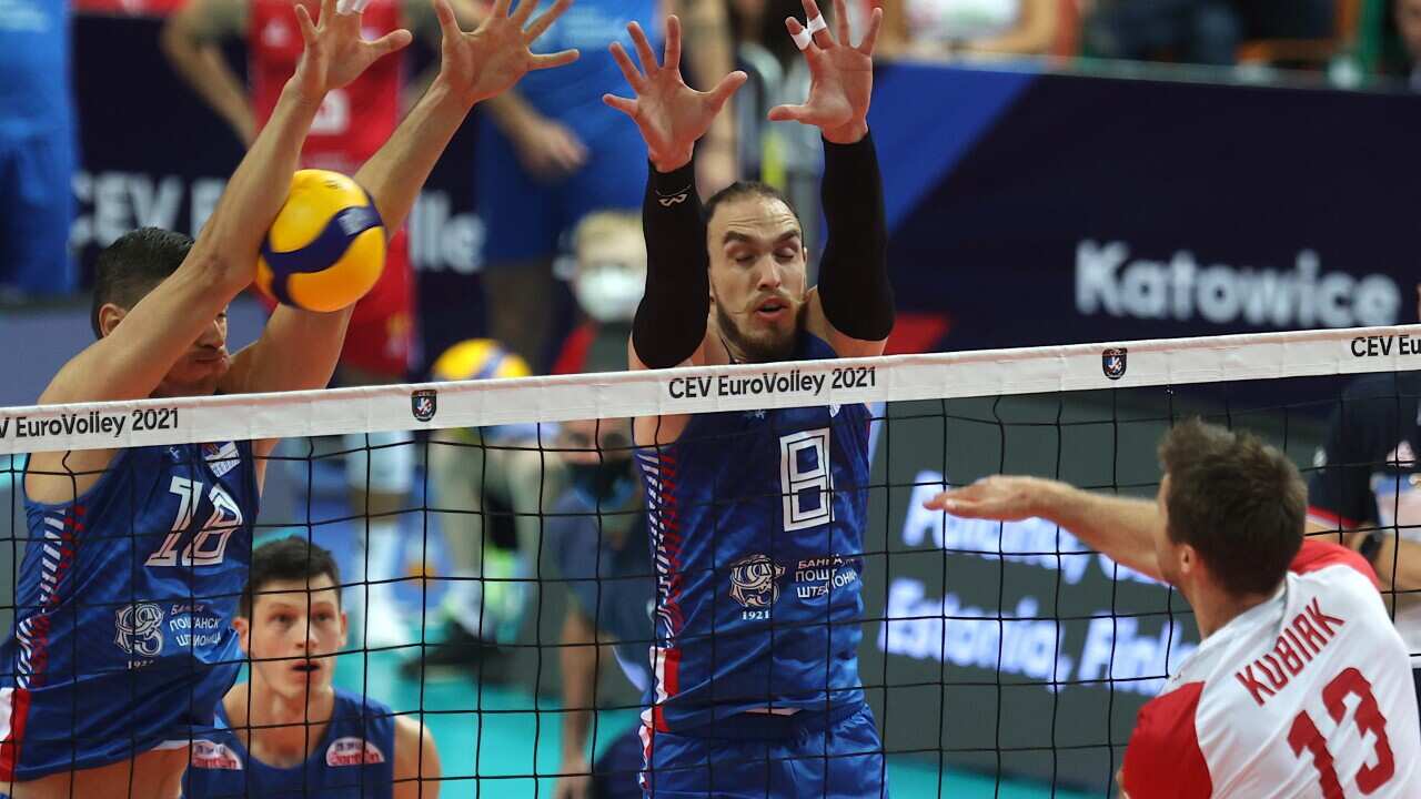 Michal Kubiak (R) of Poland in action against Serbia's Marko Ivovic (C) and Marko Podrascanin (L) in the match for the third place of the Men's European Volleyball Championship 2021 between Poland and Serbia in Katowice, Poland 19 September 2021. EPA/AND