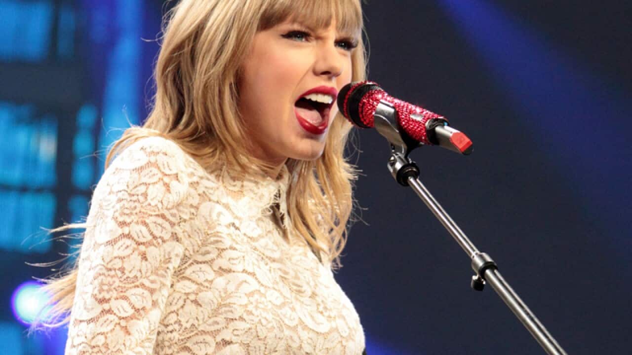 Taylor Swift performs onstage.