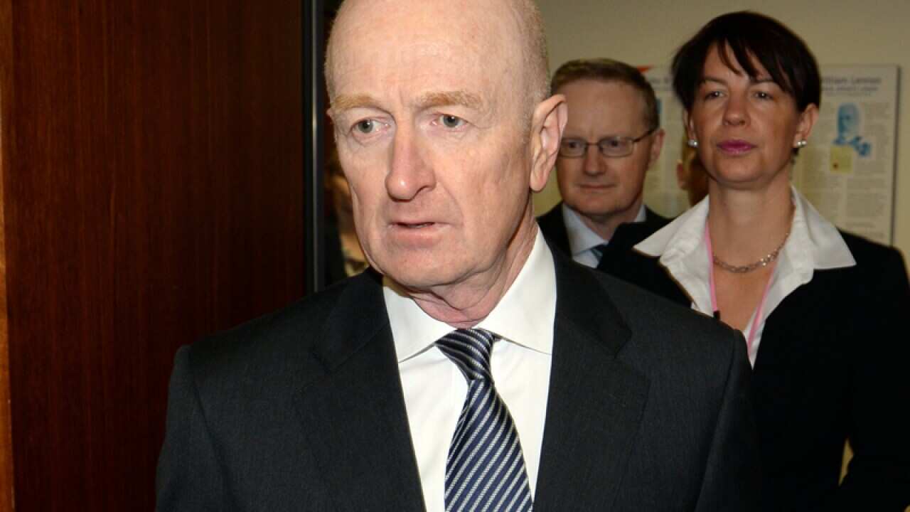 RBA Governor arrives to give an address.
