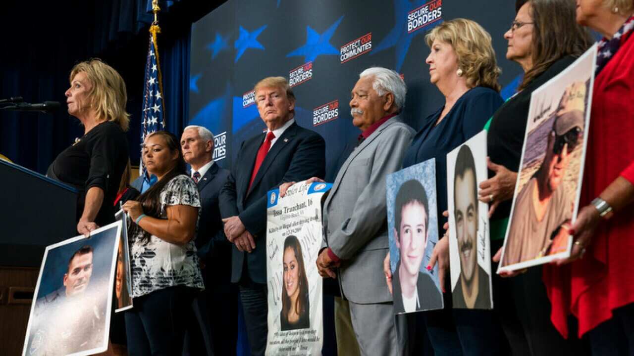 US President Donald Trump listens to Americans who have had a family member killed by an illegal immigrant.  