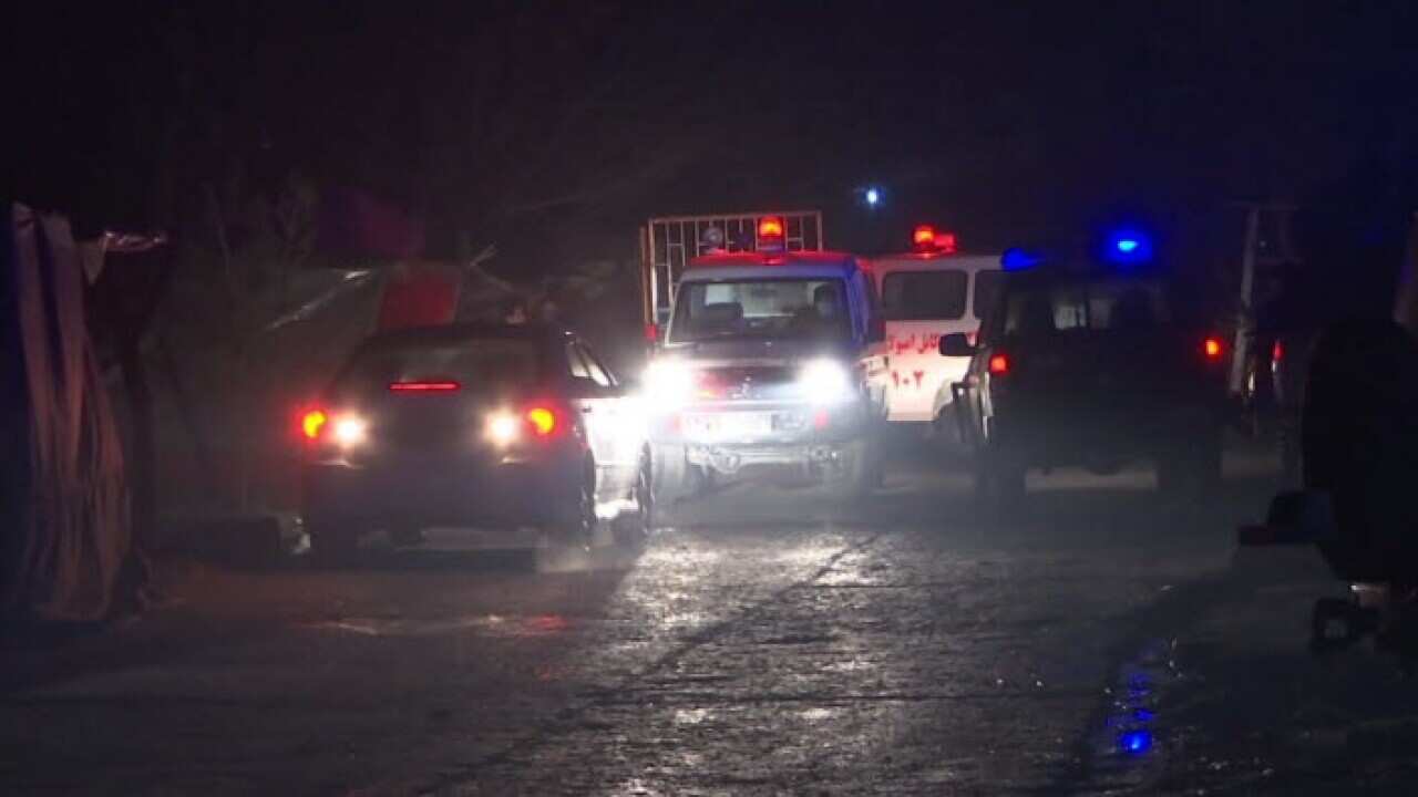 ambulances and security forces near the scene of an explosion in Kabul