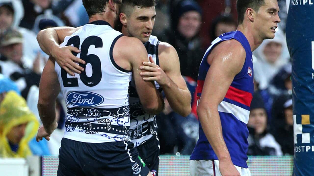Geelong players celebrate
