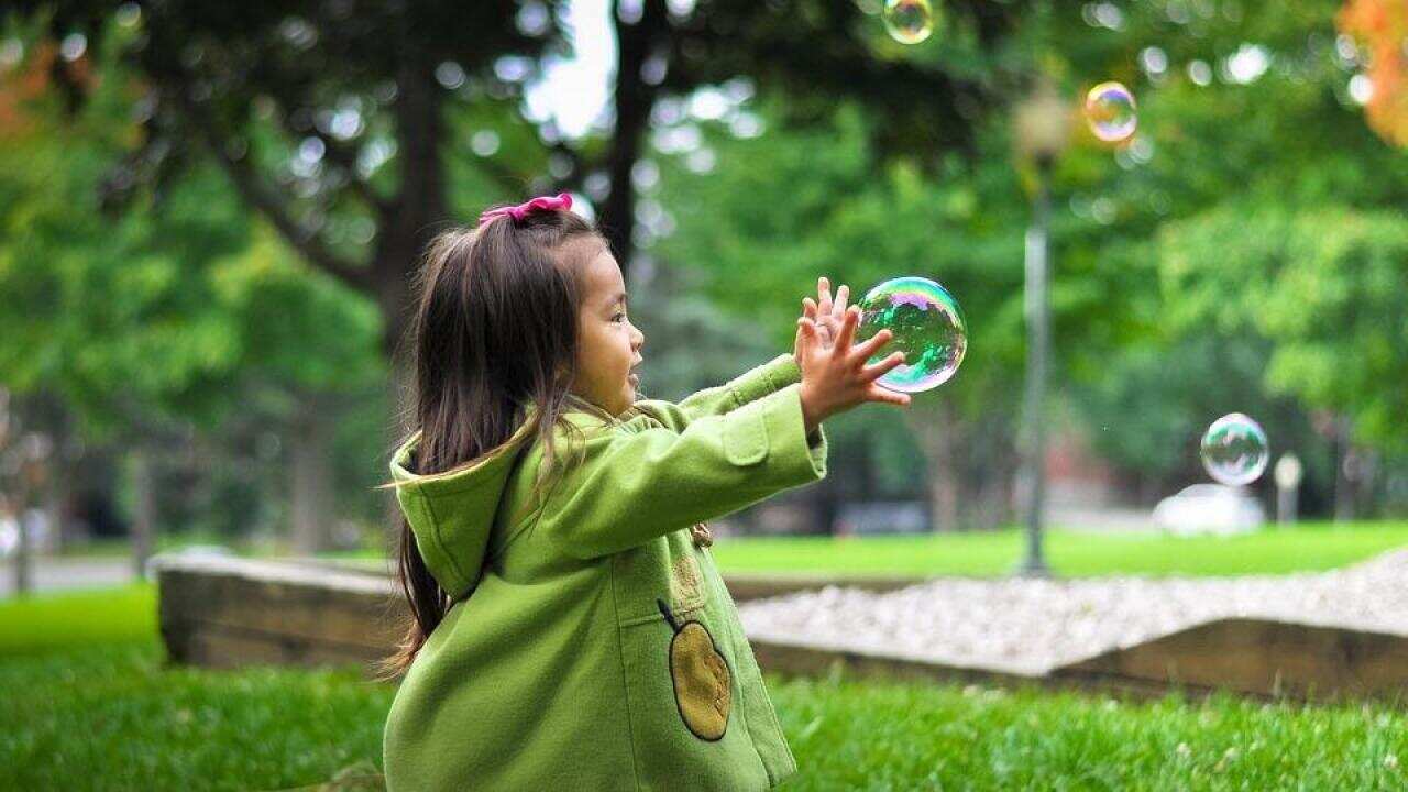 Happy little girl in a new environment