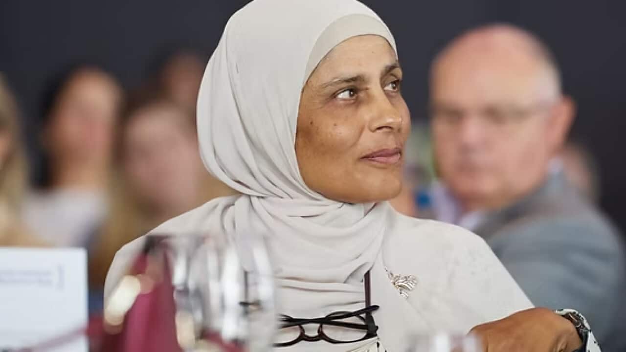 A woman in a hijab looking to the side