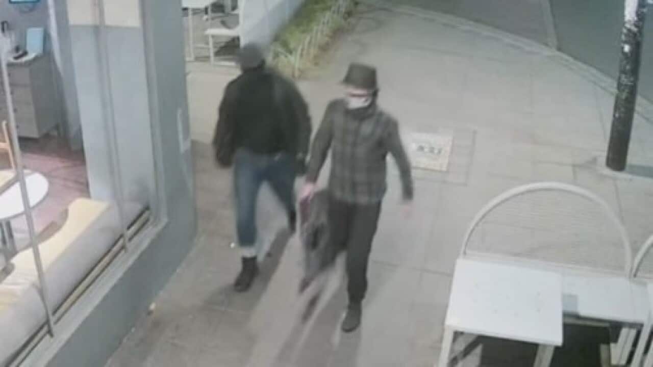 Police have released images of two men wanted over antisemitic graffiti in Melbourne.