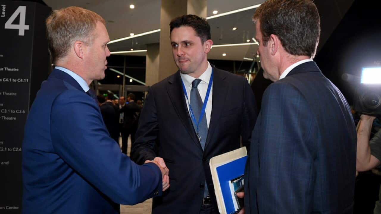 Newly elected Liberal Party Federal Director Andrew Hirst, (centre), shakes hands with Speaker of the House of Representatives Tony Smith, (left) and Minister for Veteran's Affairs Dan Tehan
