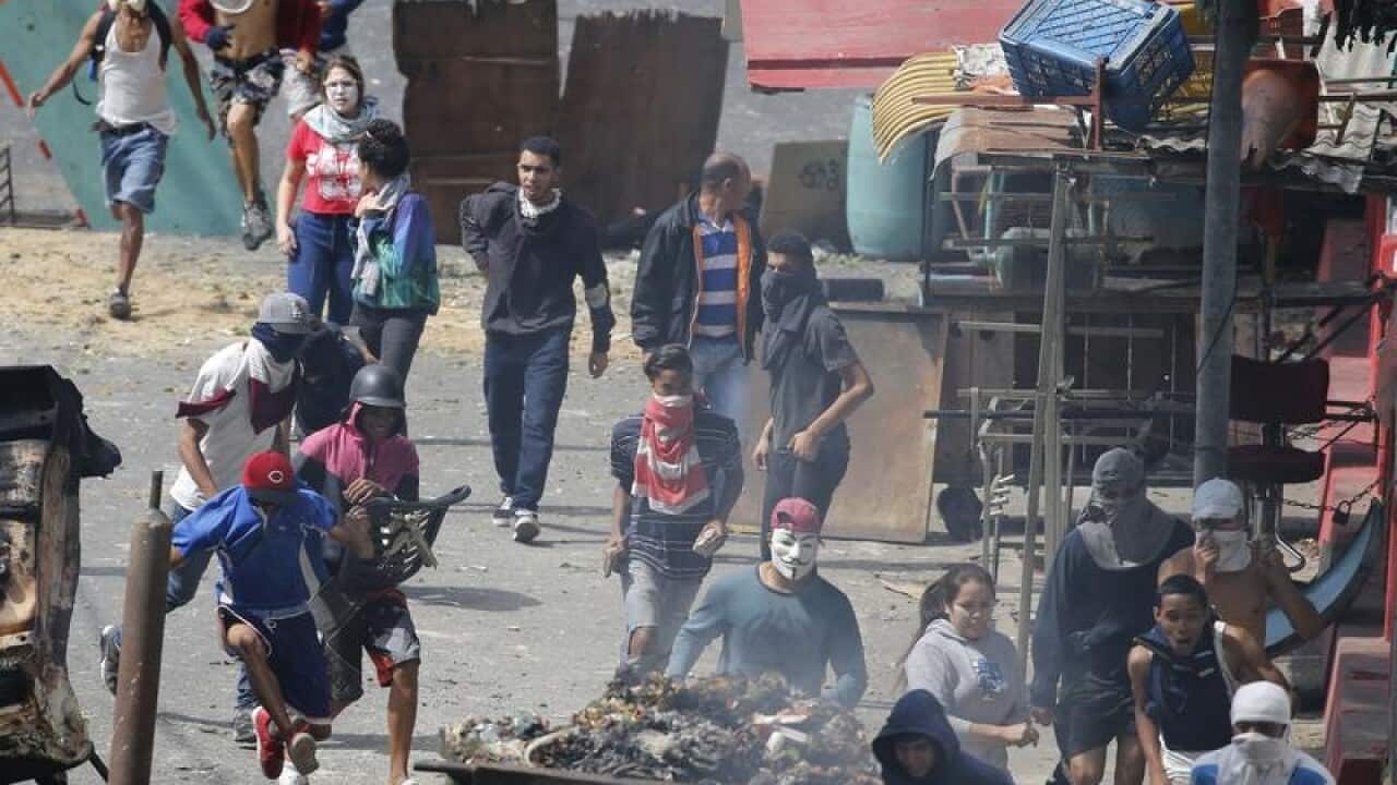 Anti-government protesters clash with security forces in Cotiza