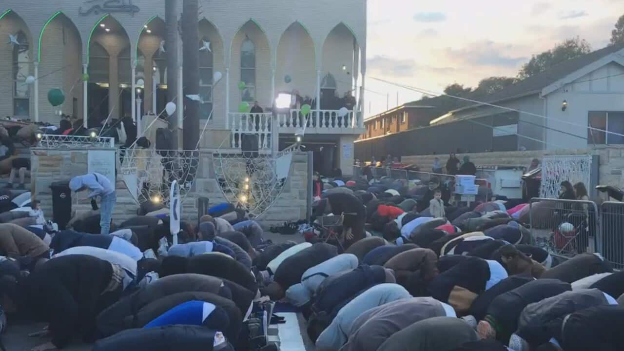 Tens of thousands of people pray at the Lakemba Mosque following the end of Ramadan.