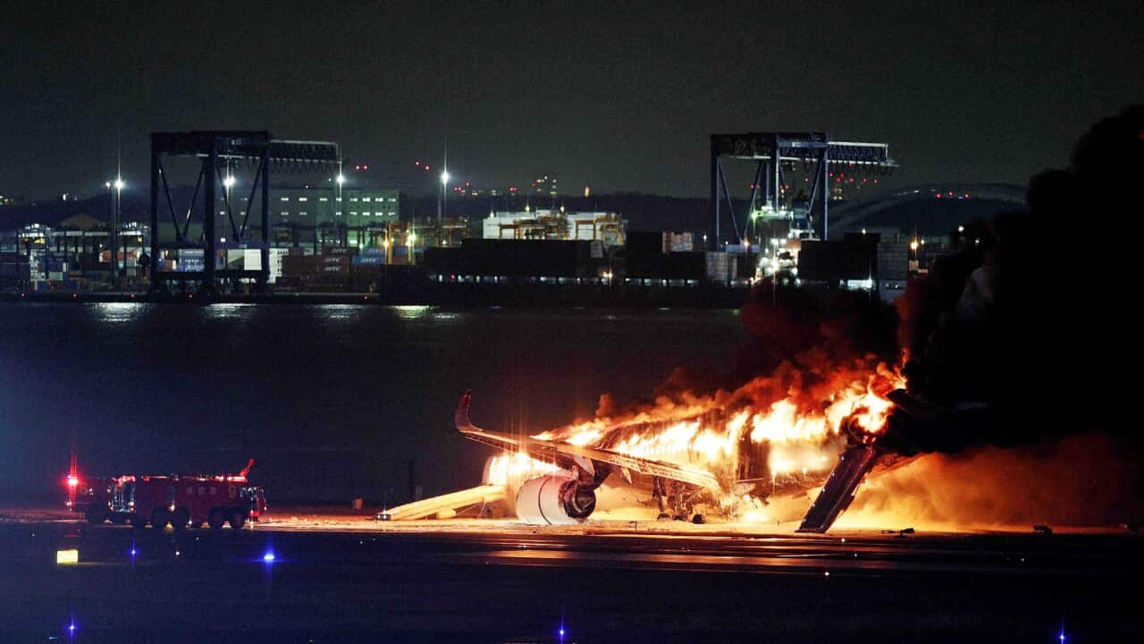 The Japan Airlines plane in flames at Tokyo's Haneda Airport after colliding with a coast guard aircraft (Getty)