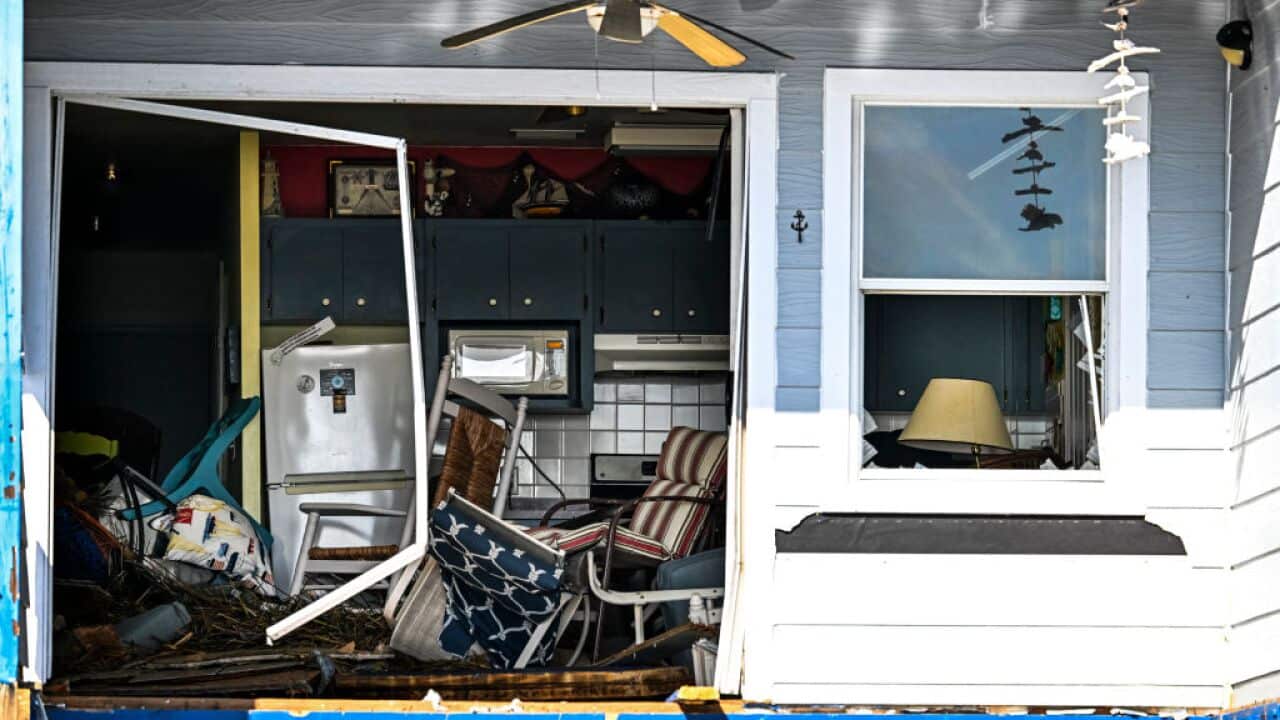 The exposed interior of a damaged house is seen after a hurricane made landfall.