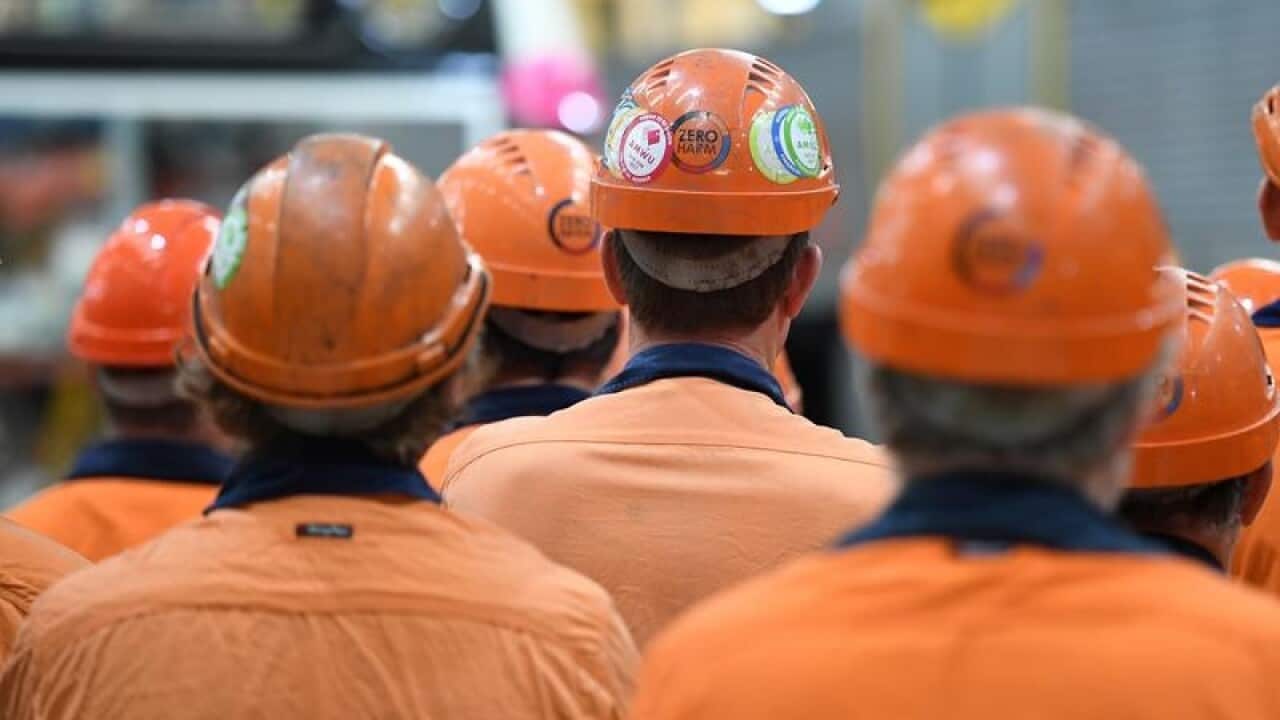 Workers at the Downer Rail workshop