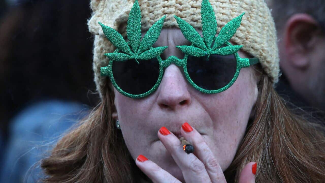 People gather for a 420 celebration of legalisation of marijuana in Toronto.