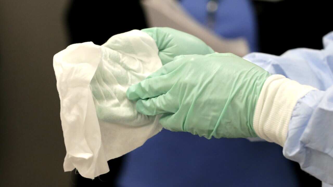 A nurse dressed in personal protective equipment