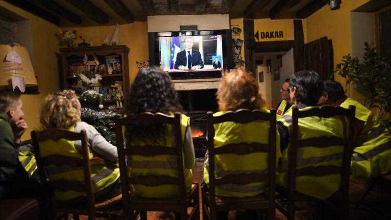 Yellow vests protesters are listening french president Emmanuel Macron speaking during a special address to the nation.