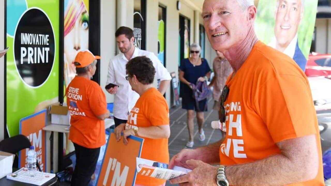 Steve Dickson and supporters hand out how-to-vote cards