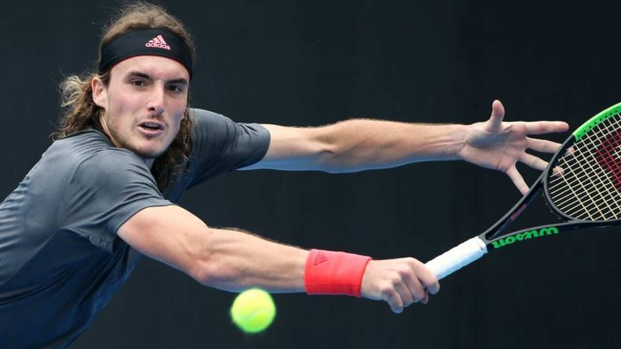 Stefanos Tsitsipas of Greece reaches to play a backhand to Andreas Seppi of Italy during their men's singles match at the Sydney International tennis tournament in Sydney, Thursday, Jan. 10, 2019. (AP Photo/Rick Rycroft)
