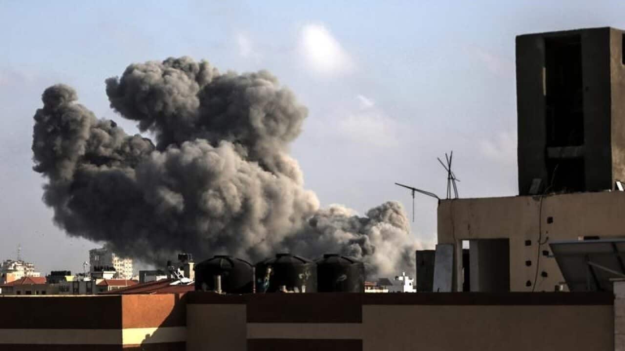 Smoke rises from a building after an Israeli air strike