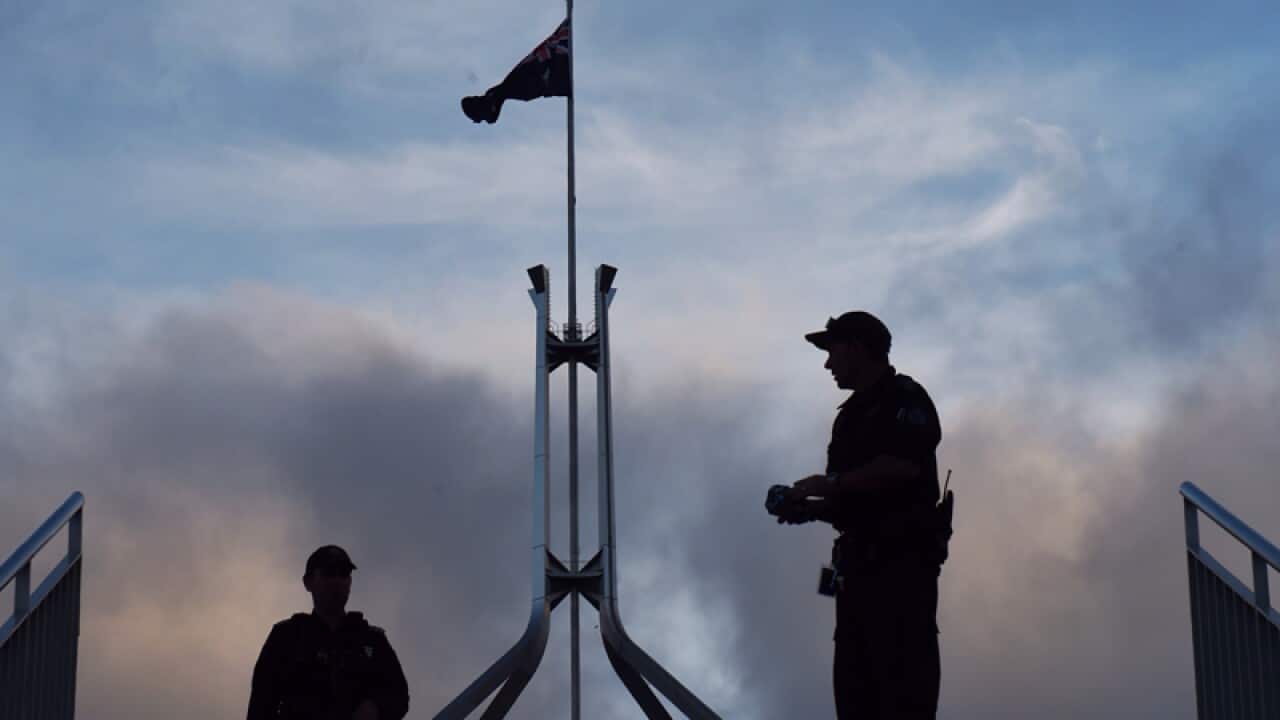 Australian Federal Police officers outside Parliament House