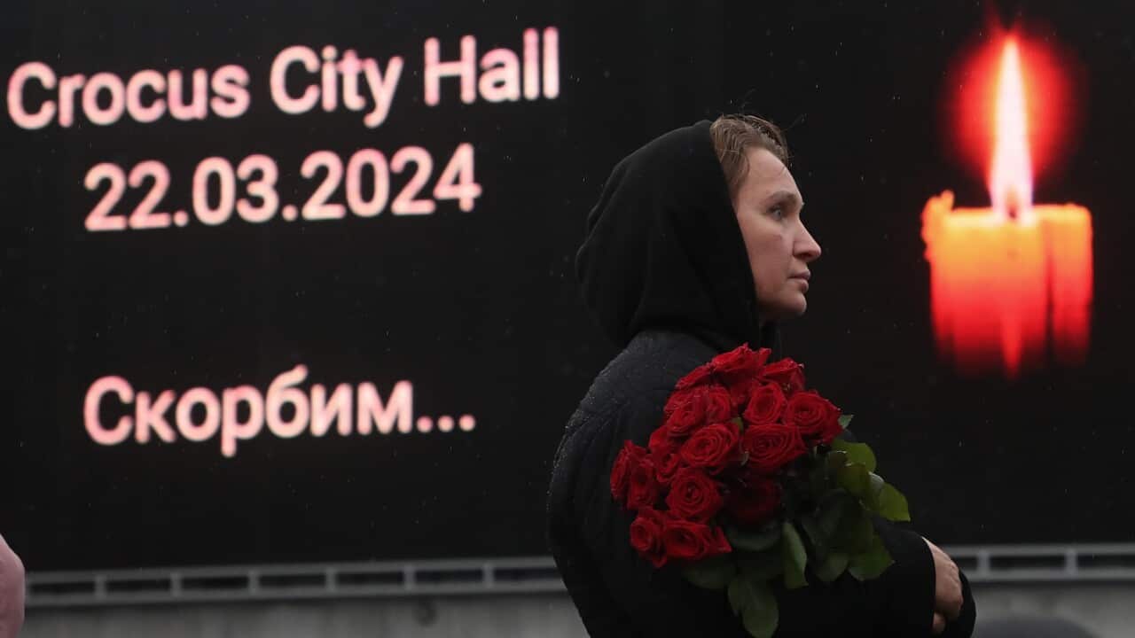People mourn and bring flowers at the Crocus City Hall concert venue following a terrorist attack in Krasnogorsk, outside Moscow, Russia, 24 March 2024.