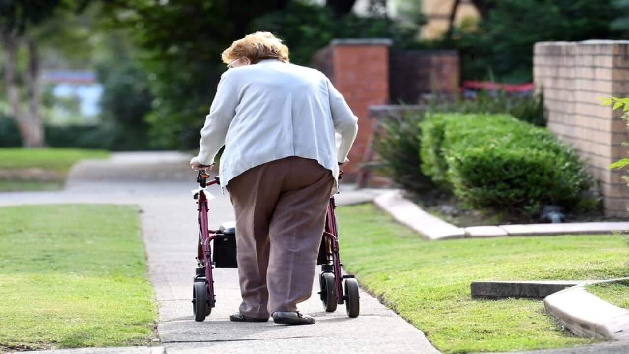 An elderly woman uses a mobility walker in Sydney (file image)