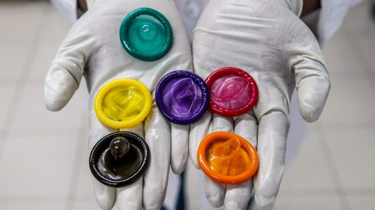 A variety of coloured condoms