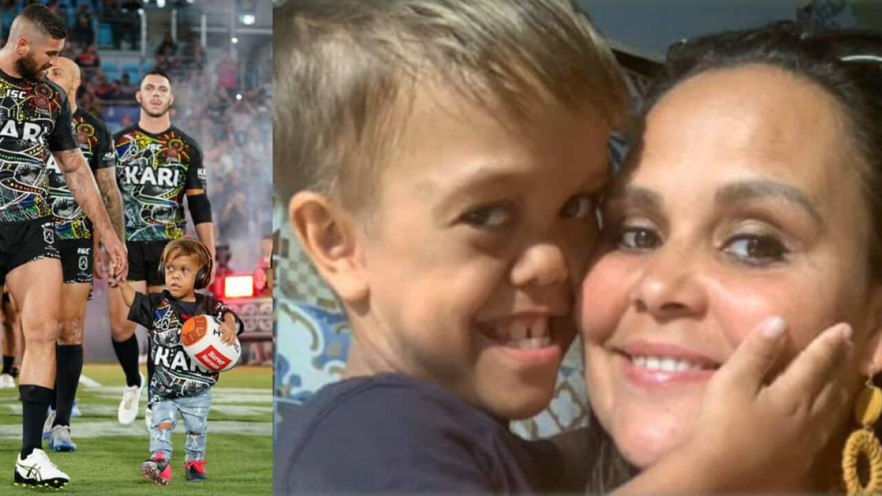 Quaden leading the Indigenous All Stars onto CBUS stadium; Quaden with his mum