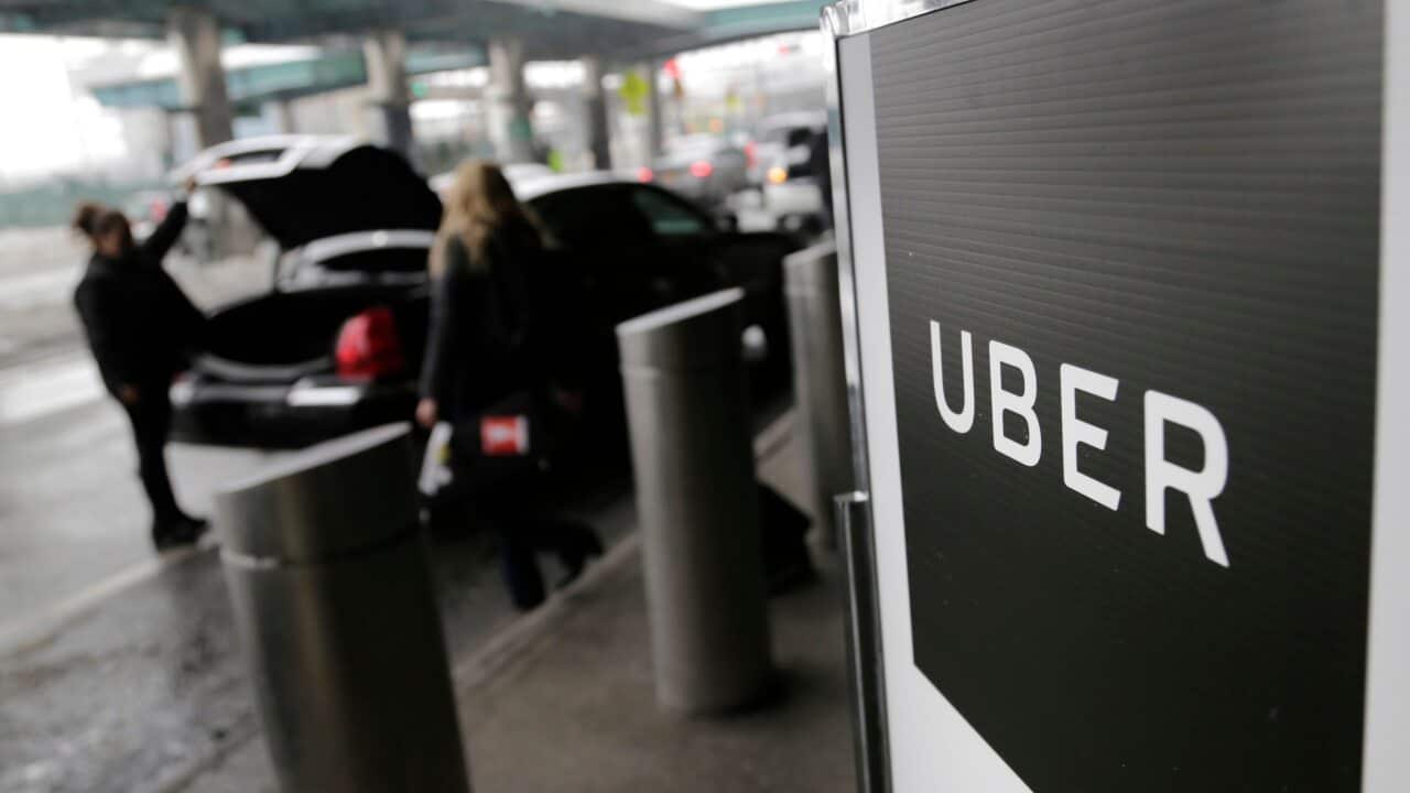 A sign marks a pick-up point for the Uber car service at LaGuardia Airport in New York.